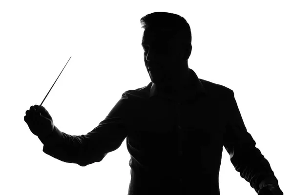 白い背景の男性のオーケストラの指揮者のシルエット — ストック写真