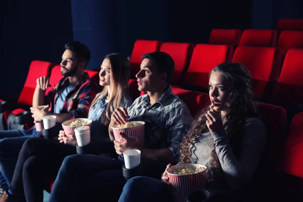 Friends watching movie in cinema