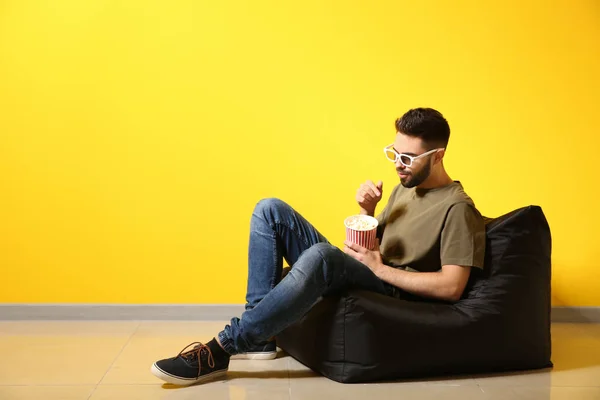 Young Man Popcorn Watching Movie While Sitting Color Wall — Stock Photo, Image