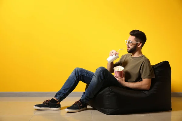 Young Man Popcorn Drink Watching Movie While Sitting Color Wall — Stock Photo, Image