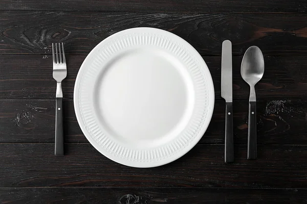 Empty Ceramic Plate Cutlery Dark Wooden Background — Stock Photo, Image