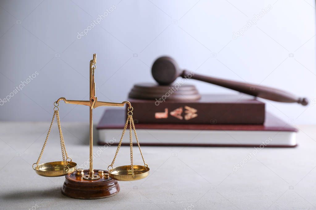 Scales of justice on light table