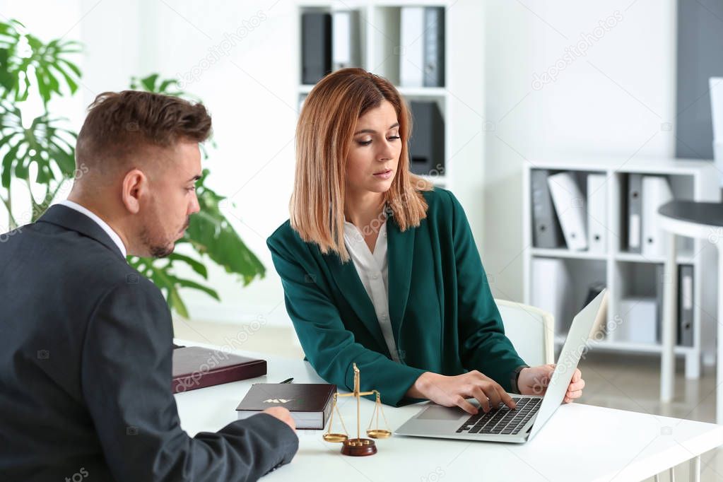 Female lawyer working with client in office