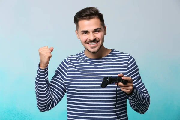 Happy Young Man Winning Video Game Color Background — Stock Photo, Image