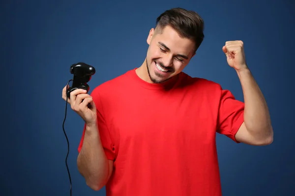 Happy Young Man Winning Video Game Color Background — Stock Photo, Image