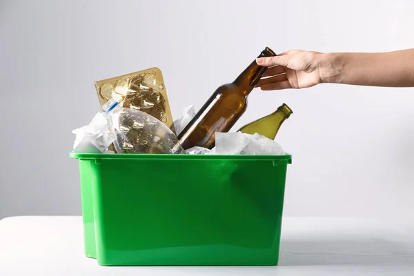 Woman Putting Empty Glass Bottle Trash Bin Light Table Recycle — Stock Photo, Image