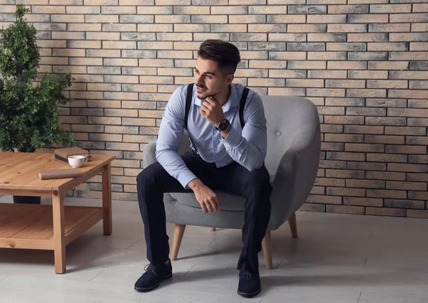 Stylish Handsome Man Sitting Armchair Brick Wall — Stock Photo, Image