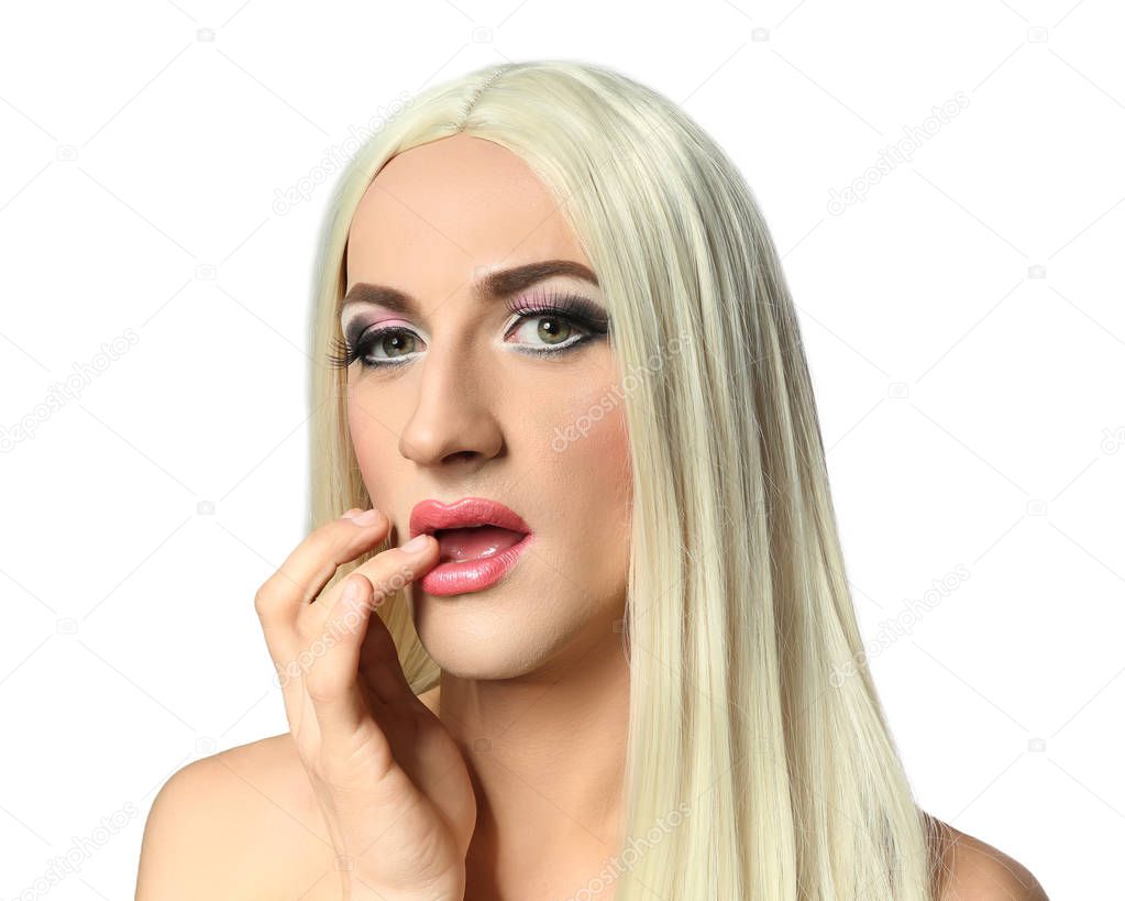 Portrait of young transgender man on white background