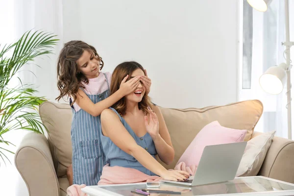 Cute Daughter Covering Mother Eyes Home — Stock Photo, Image