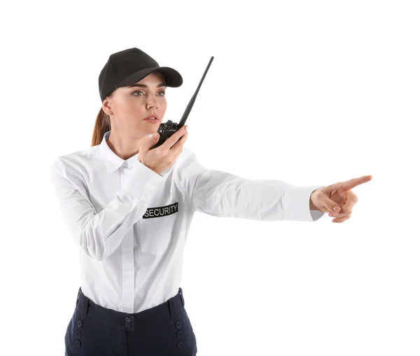 Female security guard with portable radio transmitter on white background