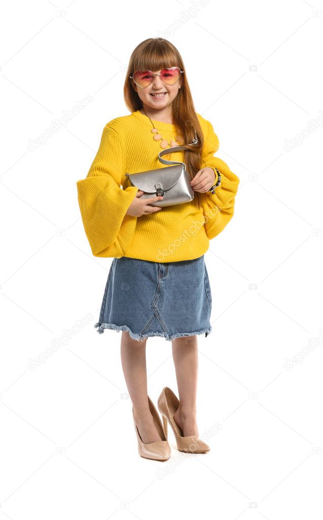 Portrait of cute little fashionista on white background