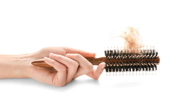 Female Hand Holding Brush Fallen Hair White Background — Stockfoto