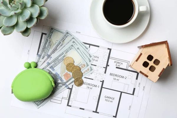 Composition with project of house, wallet and money on white background. Mortgage concept