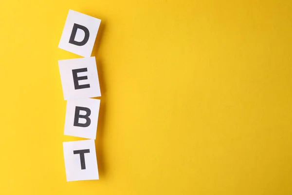 Слово Debt Цветном Фоне — стоковое фото