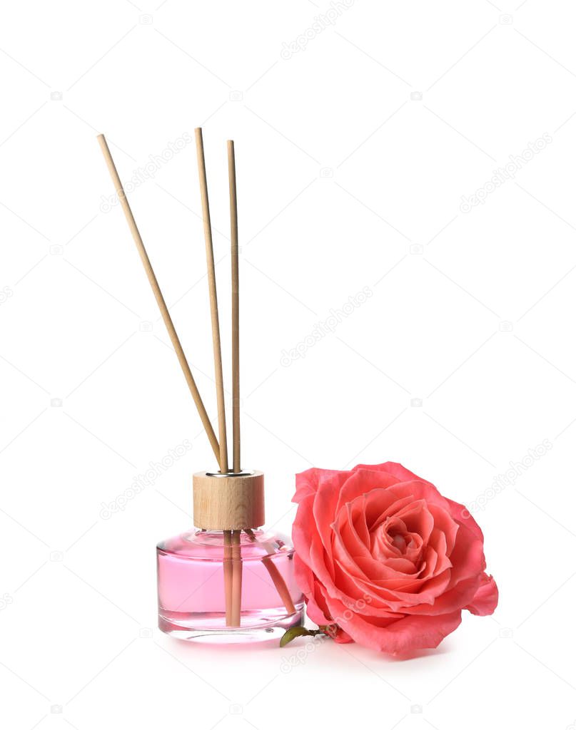 Rose reed diffuser on white background