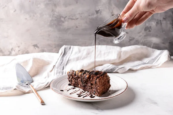 Pouring Tasty Sauce Gravy Boat Chocolate Cake — Stock Photo, Image