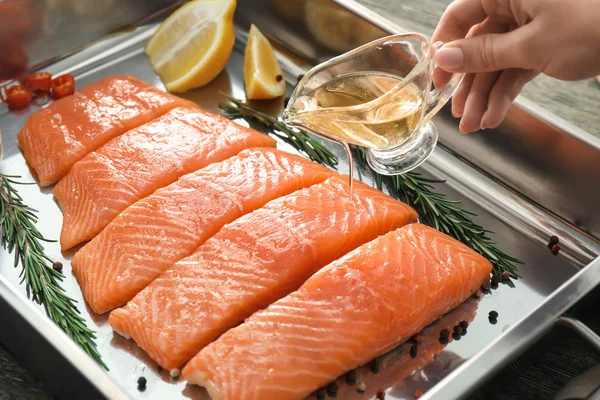 Woman Pouring Raw Salmon Fillet Oil — Stock Photo, Image