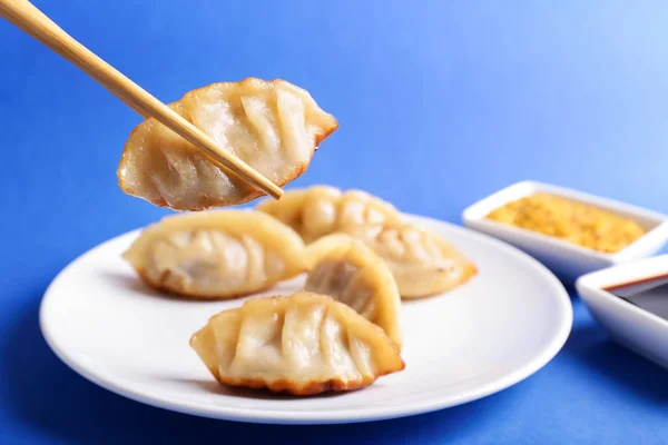 Eating Tasty Japanese Gyoza Closeup — Stock Photo, Image