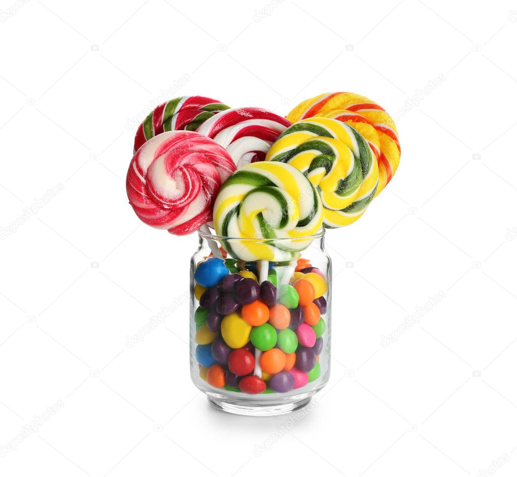 Glass jar with sweet candies on white background