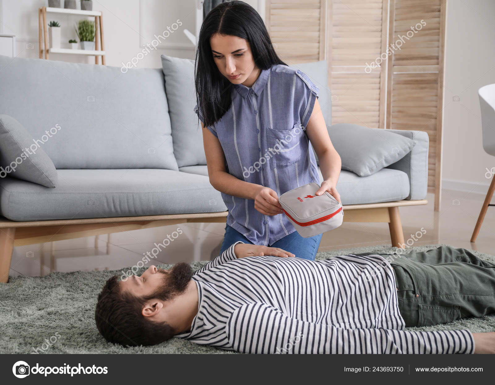 Woman Providing First Aid Her Unconscious Husband Home Stock Photo by
