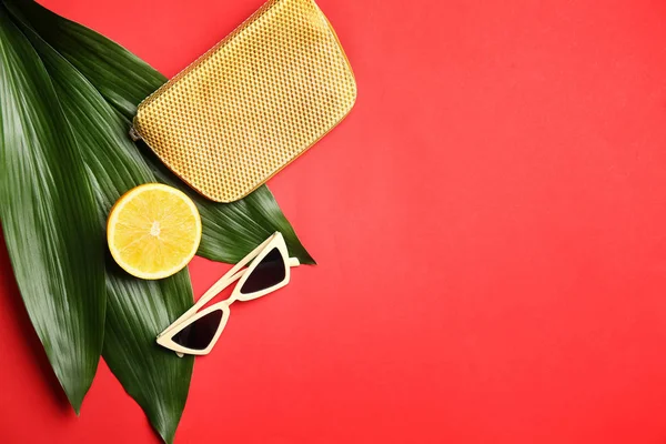 Stylish Sunglasses Orange Fruit Bag Tropical Leaves Color Background — Stock Photo, Image
