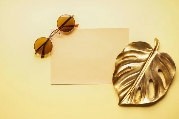 Empty Paper Sheet Sunglasses Golden Tropical Leaf Light Background — Stock Photo, Image