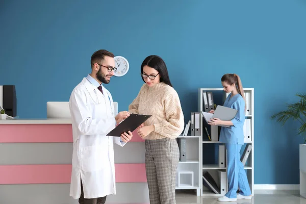 Doctor consulting patient in private clinic