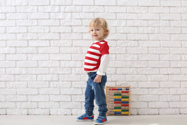 Portrait Cute Little Boy Abacus White Brick Wall — Stock Photo, Image