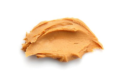 Beyaz arka planda lezzetli fıstık ezmesi.