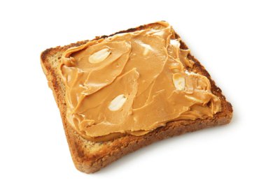 Lezzetli fıstık ezmesi beyaz zemin üzerine kızarmış ekmek