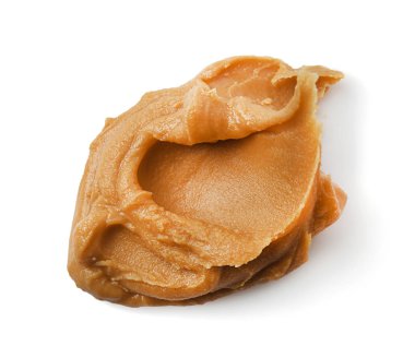 Beyaz arka planda lezzetli fıstık ezmesi.