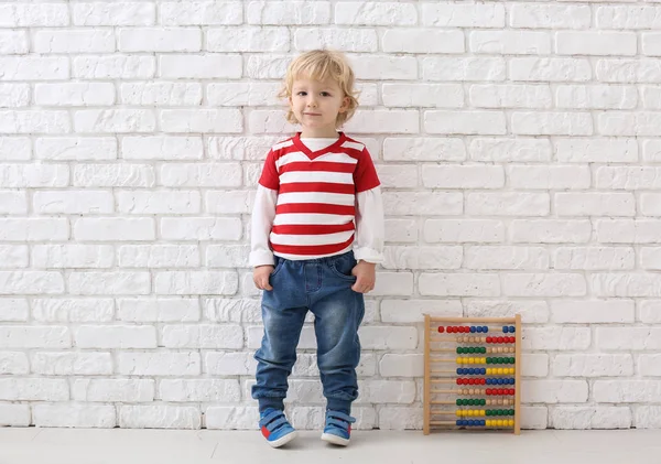 Portrait Cute Little Boy Abacus White Brick Wall — Stock Photo, Image