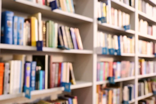 Many Books Shelves Modern Library Blurred View — Stock Photo, Image