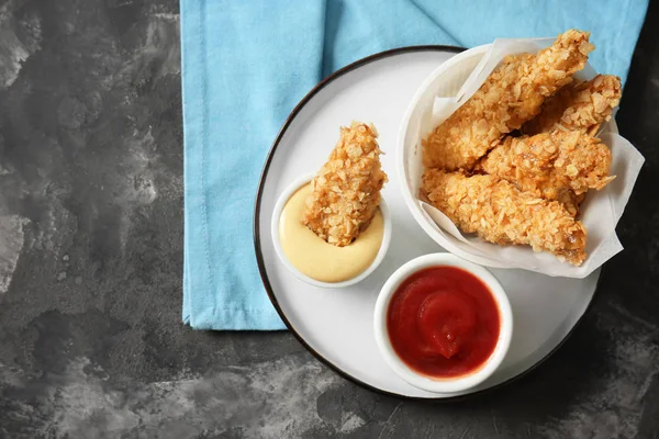 Plate Tasty Nuggets Sauces Grey Table — Stock Photo, Image