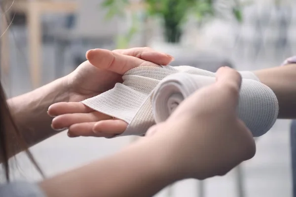 Woman Applying Bandage Female Wrist Closeup — Stock Photo, Image