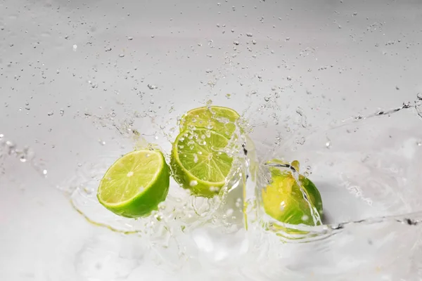 Ripe Cut Lime Water Splash White Background — Stock Photo, Image
