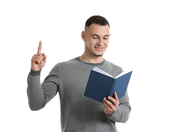 Schöner Junger Mann Mit Buch Und Erhobenem Zeigefinger Auf Weißem — Stockfoto