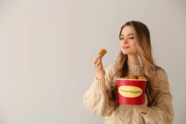 Young Woman Bucket Tasty Nuggets Light Background — Stock Photo, Image