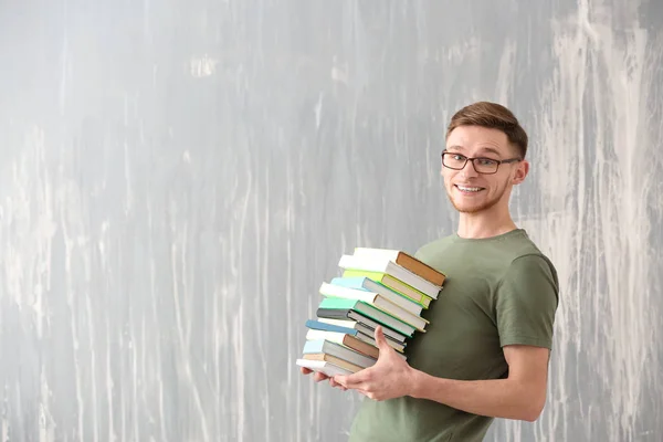 Handsome Young Man Books Grunge Background — Stock Photo, Image