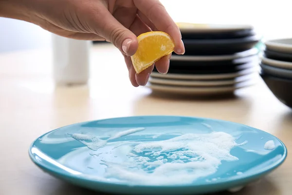 Woman Squeezing Lemon Juice Plate Foam Cleaning — Stock Photo, Image