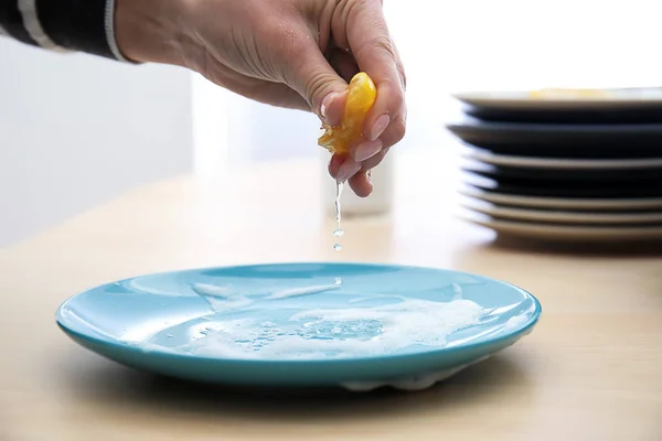 Woman Squeezing Lemon Juice Plate Foam Cleaning — Stock Photo, Image