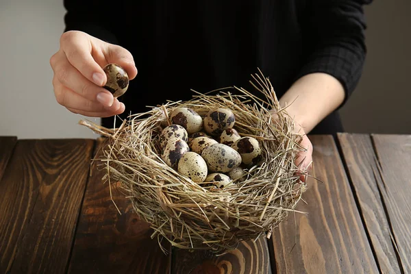 Woman Holding Nest Quail Eggs Wooden Table — Stock Photo, Image