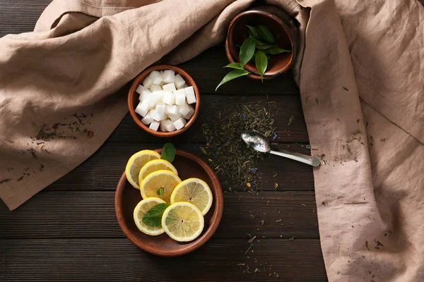 Dry Tea Leaves Bowl Lemon Slices Sugar Wooden Table — Stock Photo, Image