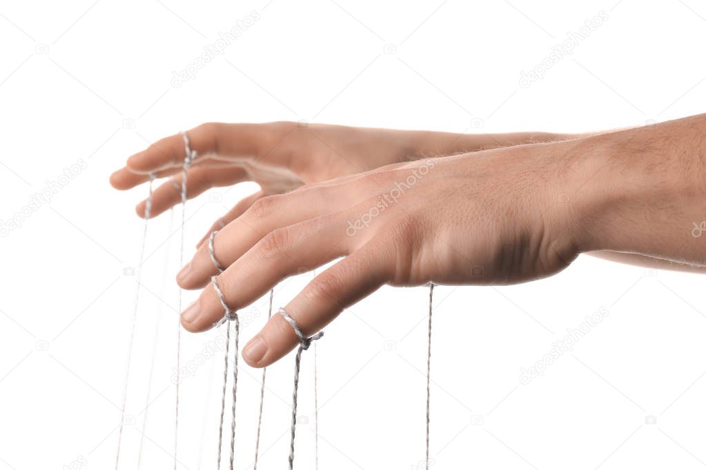 Hands of puppeteer on white background