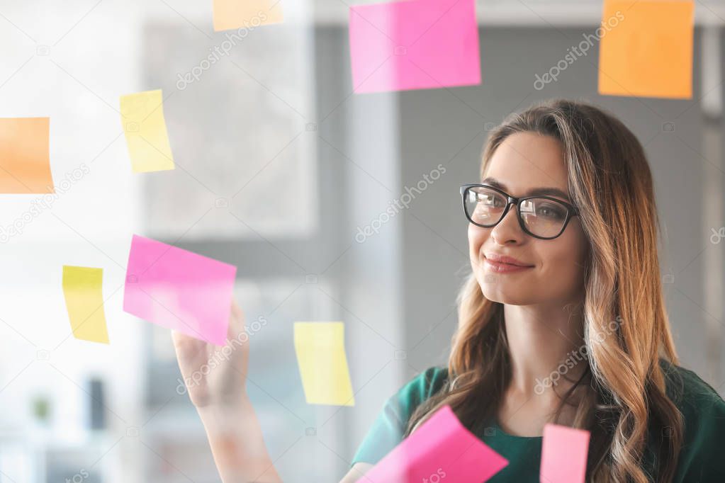 View at woman during business meeting in office through transparent board