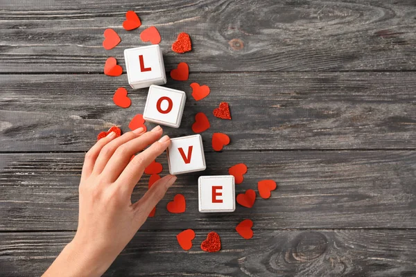 Female Hand Composing Word Love Cubes Wooden Background Valentines Day — Stock Photo, Image