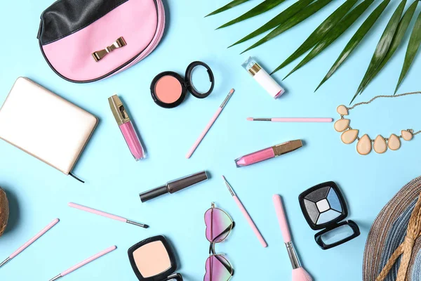 Flat lay composition with cosmetics and accessories on color background