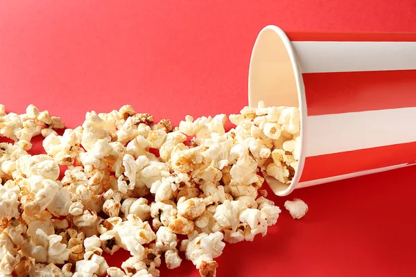Overturned Paper Cup Tasty Popcorn Color Background — Stock Photo, Image