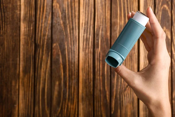 Female Hand Inhaler Asthma Wooden Background — Stock Photo, Image