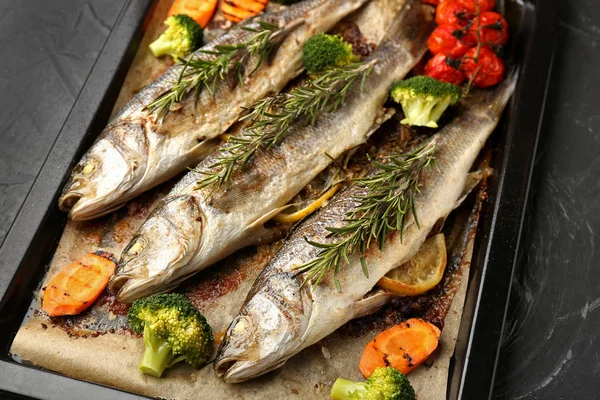 Baking Sheet Tasty Cooked Seabass Fish Vegetables Dark Table — Stock Photo, Image